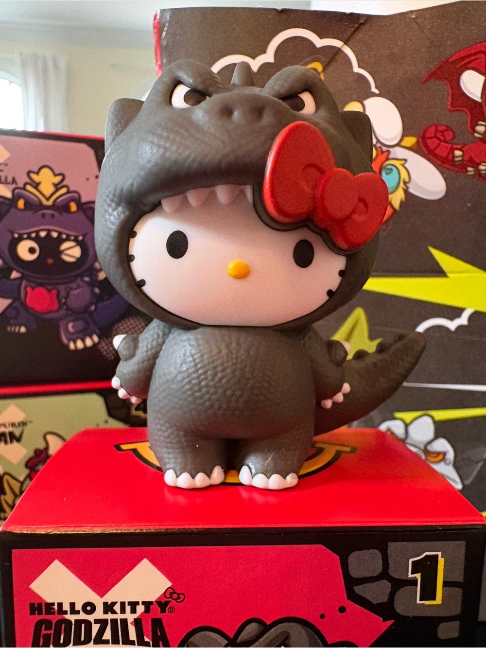 Limited Edition Sanrio Hello Kitty Godzilla Figure in Gray with Red Bow